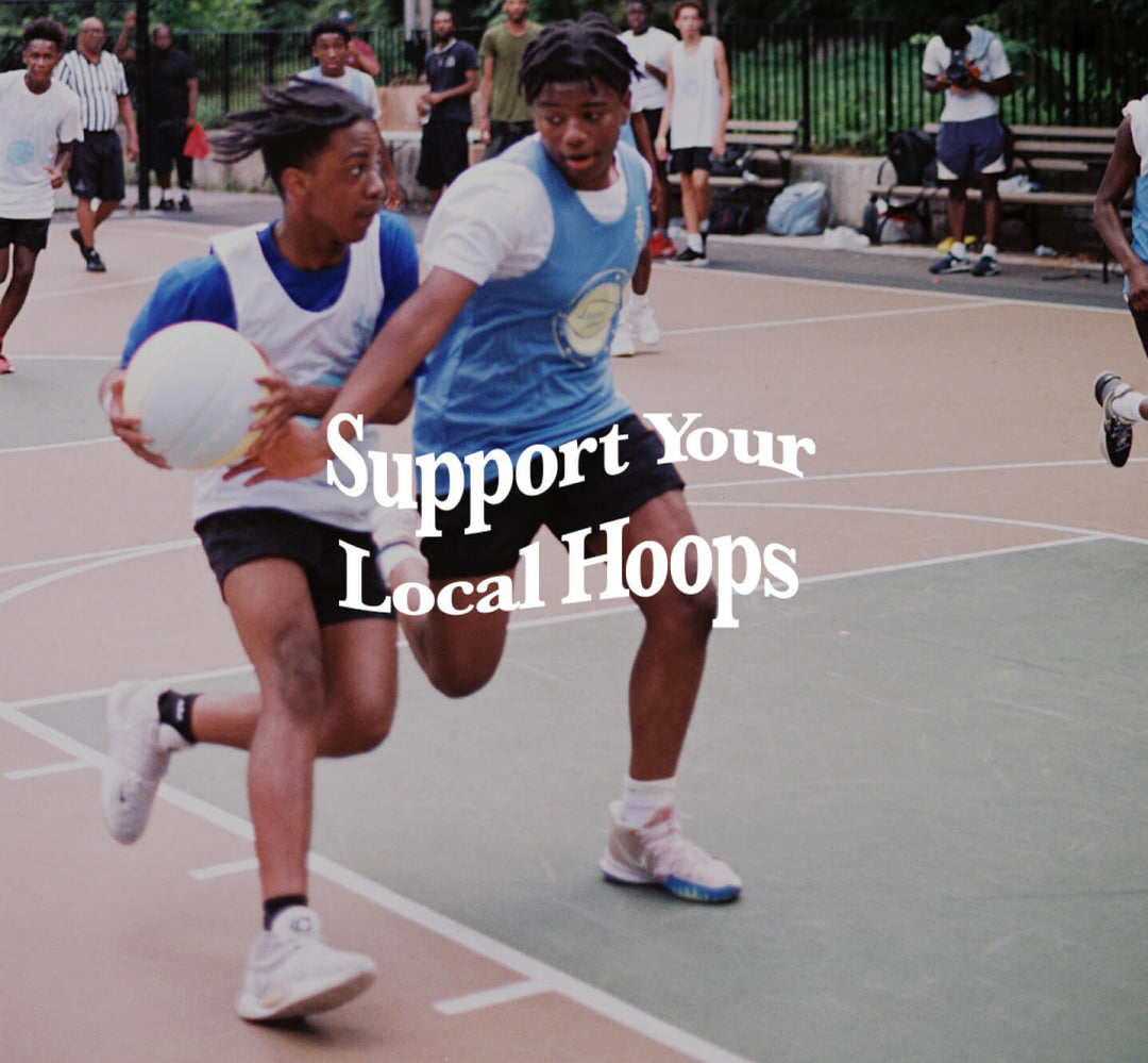 Support your local hoops written on top of a photo of two young people playing basketball